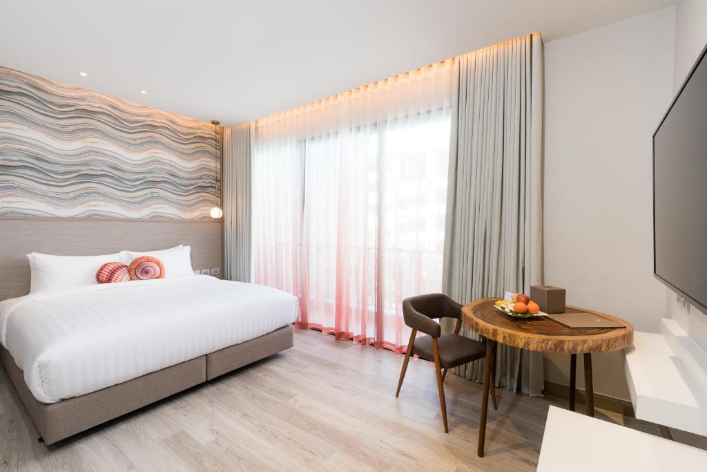Postel nebo postele na pokoji v ubytování Maven Stylish Hotel Hua Hin