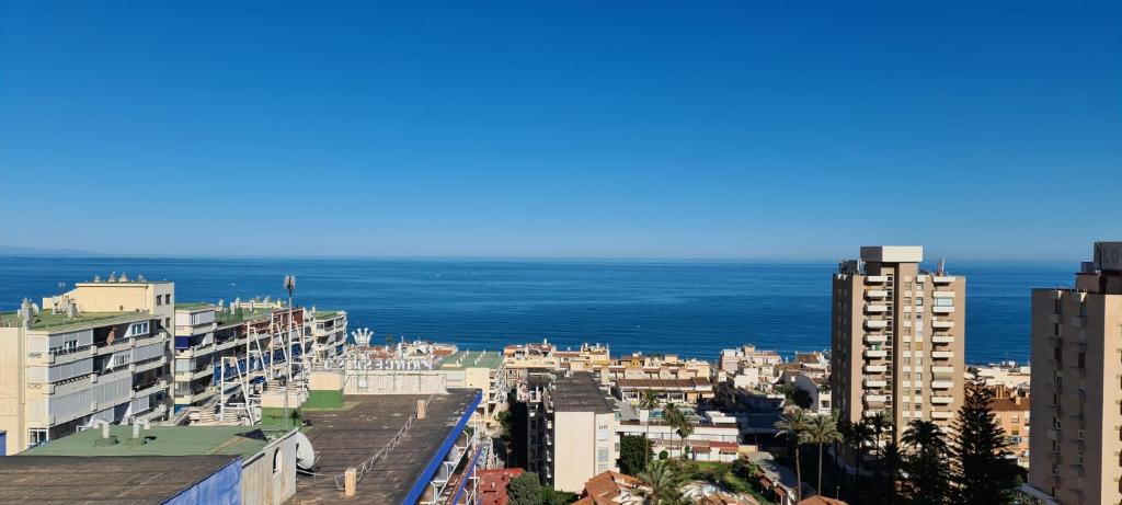 a view of a city with the ocean in the background at Torremolinos holiday Sun & Sea in Torremolinos