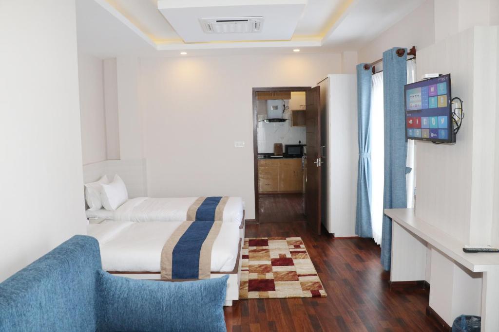 TV a/nebo společenská místnost v ubytování Hotel Mega & Apartment