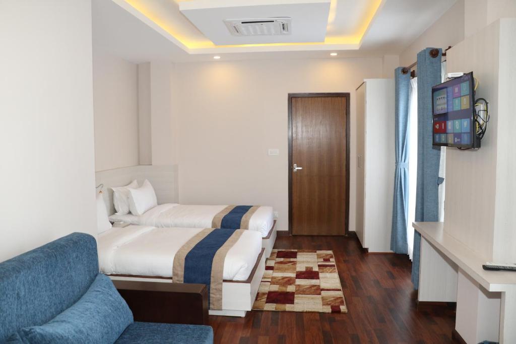 Postel nebo postele na pokoji v ubytování Hotel Mega & Apartment