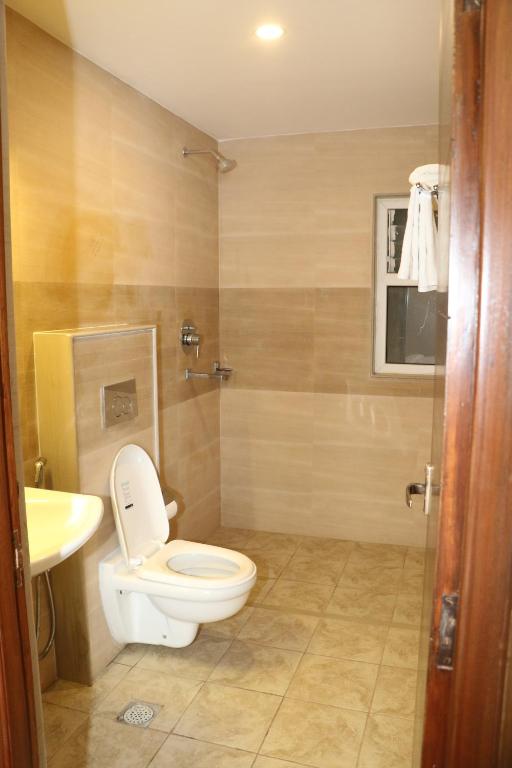 Koupelna v ubytování Hotel Mega & Apartment