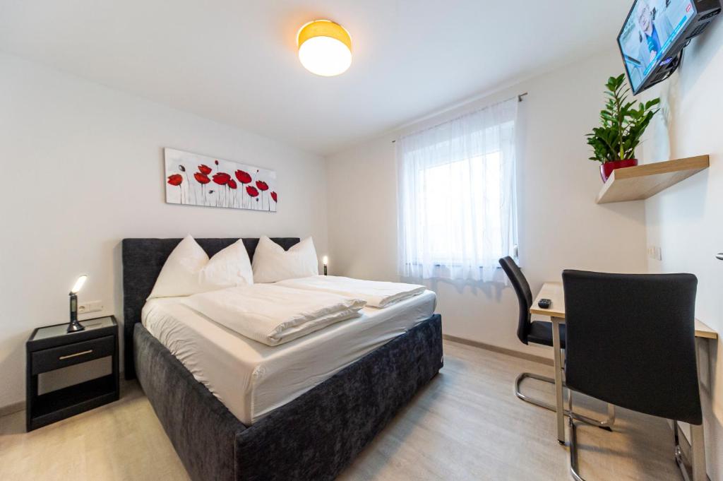 Postel nebo postele na pokoji v ubytování Zeltweg-Rooms