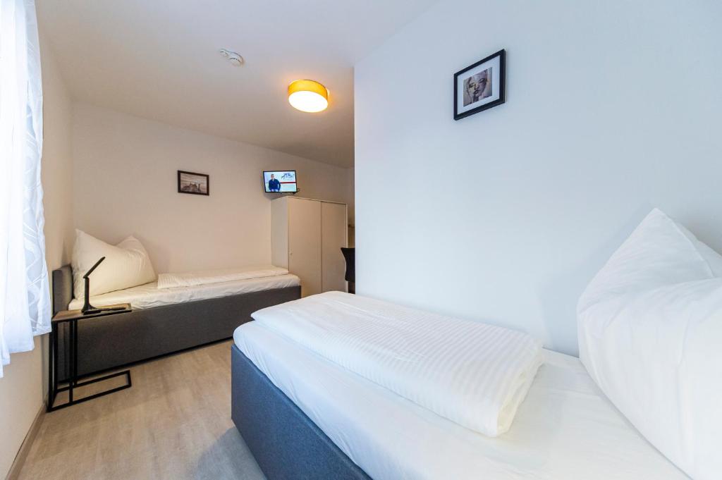 Postel nebo postele na pokoji v ubytování Zeltweg-Rooms