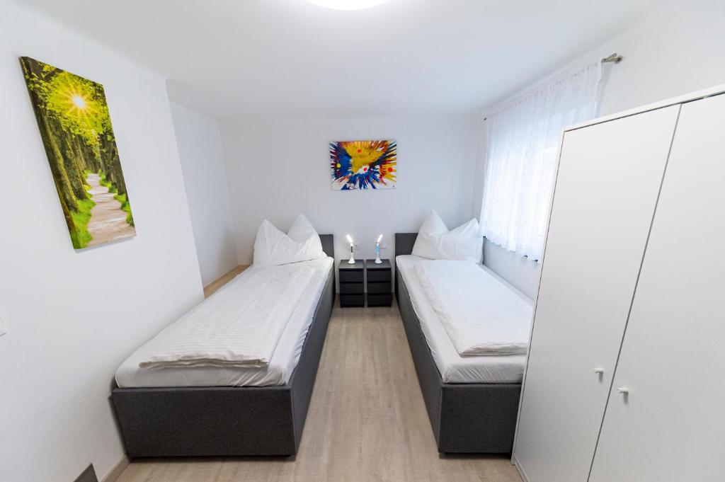 Postel nebo postele na pokoji v ubytování Zeltweg-Rooms