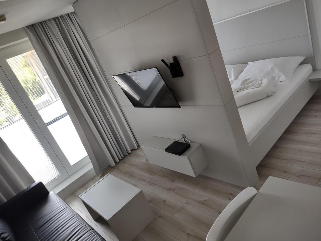Postel nebo postele na pokoji v ubytování Apartmany Arcadia