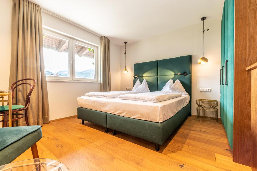 Postel nebo postele na pokoji v ubytování Hotel Bruggwirt
