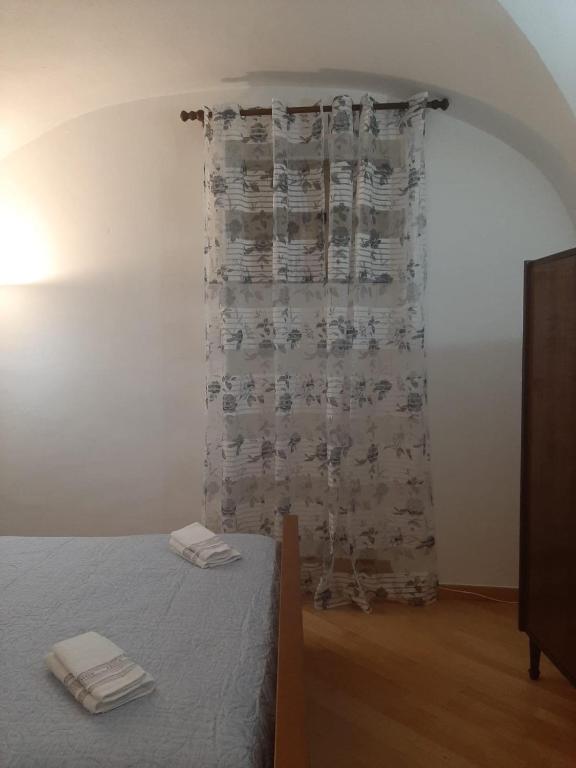 Postel nebo postele na pokoji v ubytování Alloggi Piazza Umberto Primo