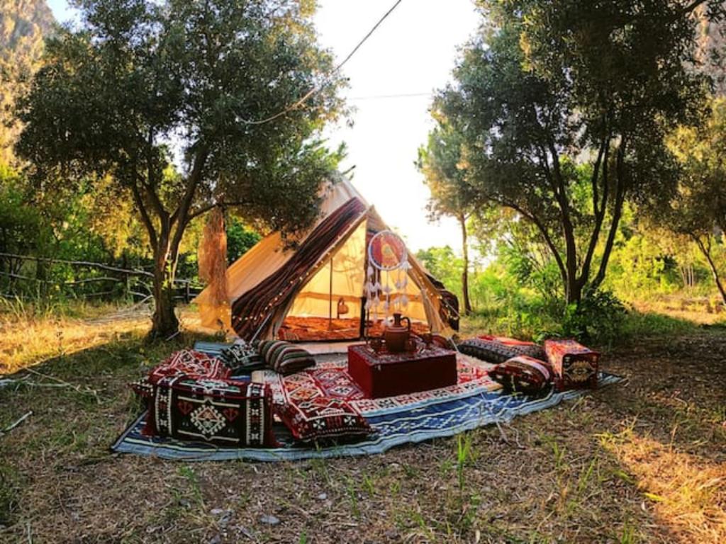 a tent that is sitting in the grass at Butterfly Valley Beach Glamping with Food in Oludeniz