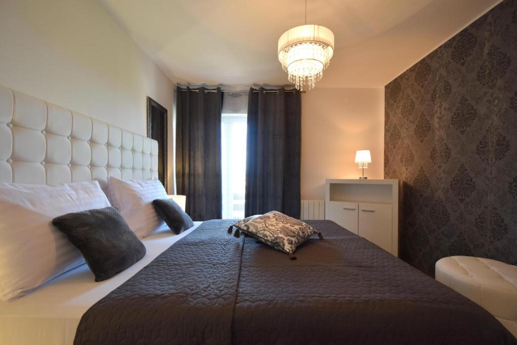 Postel nebo postele na pokoji v ubytování Apartments Antonija