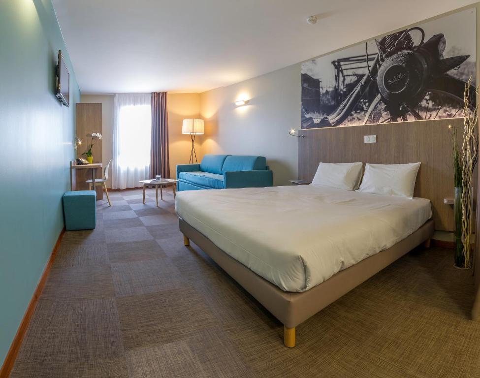 Кровать или кровати в номере The Originals City, Hôtel Ecoparc, Montpellier Est (Inter-Hotel)