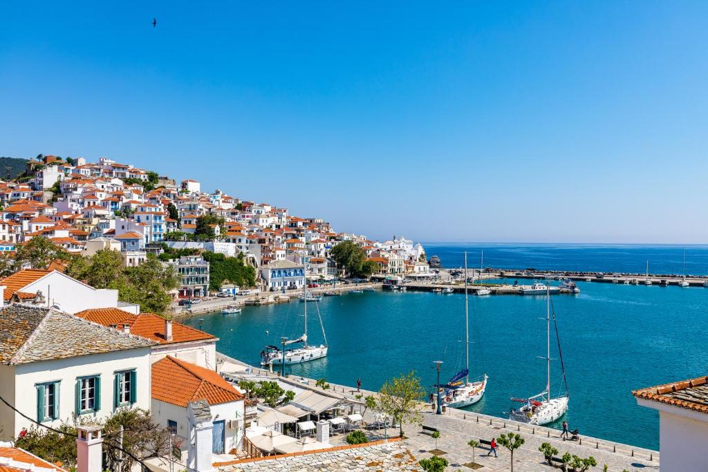 a view of a harbor with boats in the water at Regina Hotel in Skopelos Town