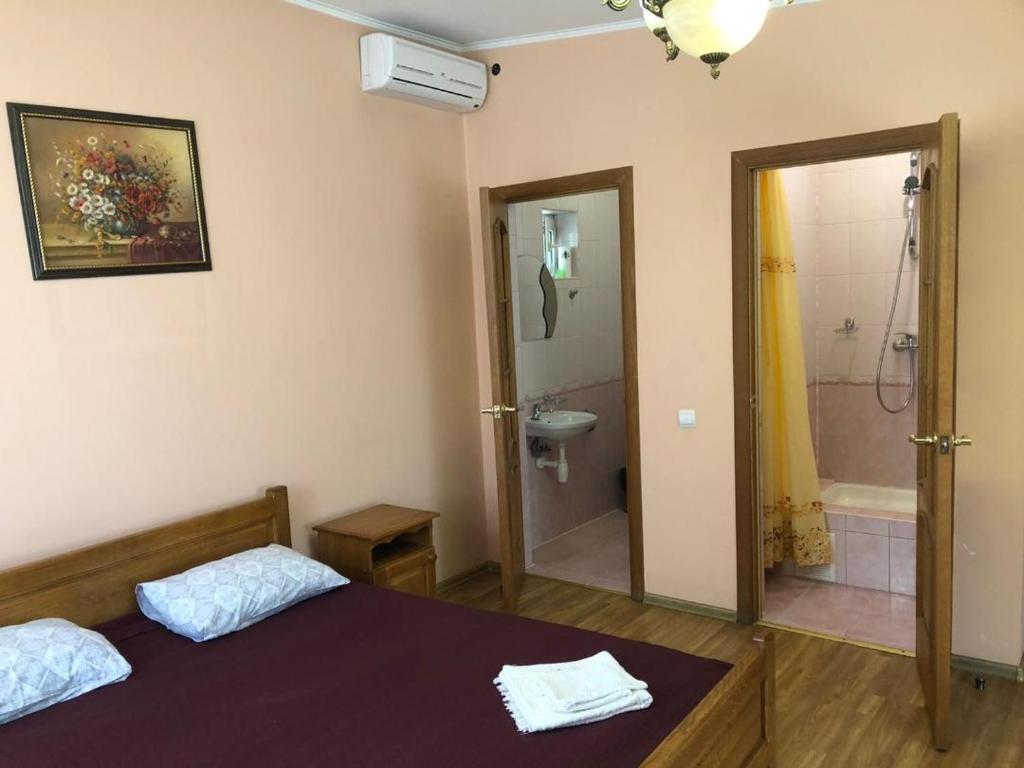 Postel nebo postele na pokoji v ubytování Hotel Nikolet