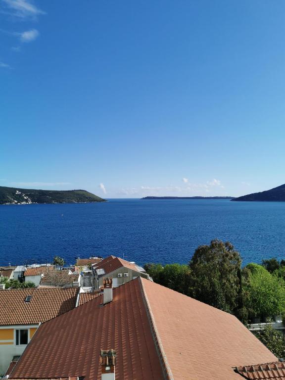 a view of the water from the roof of a house at The View Savina - Herceg Novi in Herceg-Novi