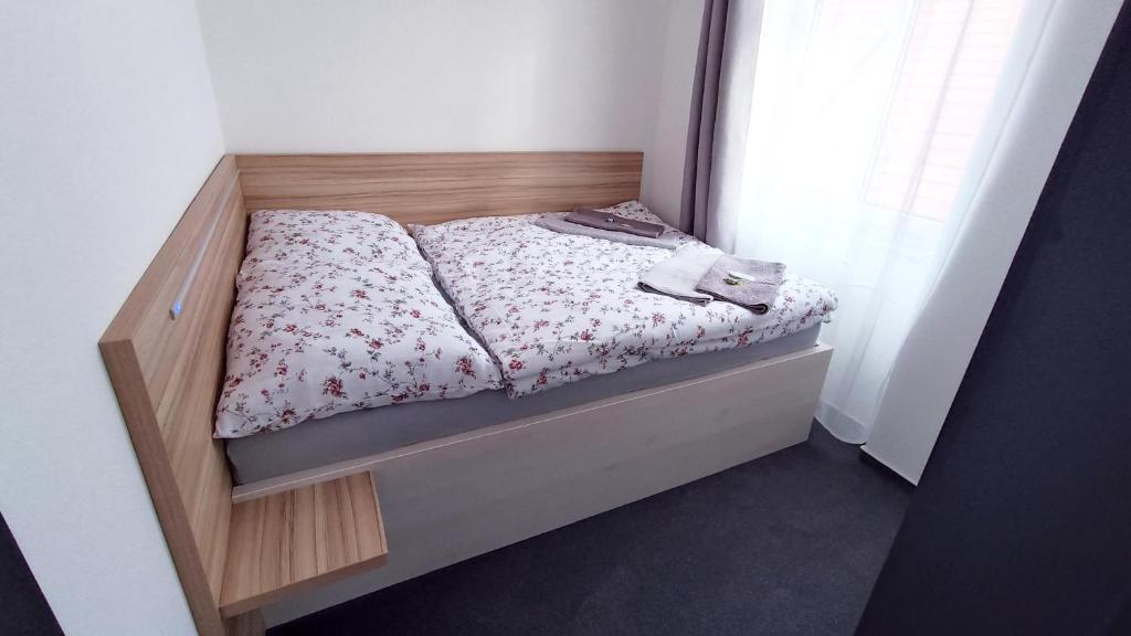 Postel nebo postele na pokoji v ubytování Penzion HARMONIE