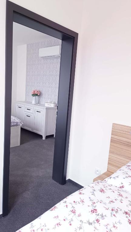 Postel nebo postele na pokoji v ubytování Penzion HARMONIE