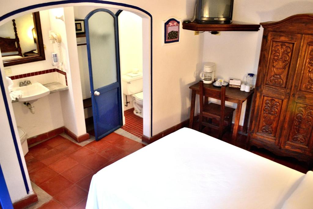 Postel nebo postele na pokoji v ubytování Posada del Cafeto