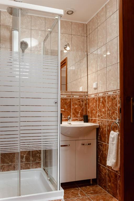 Koupelna v ubytování Kotyogó Apartmanok, Bogács