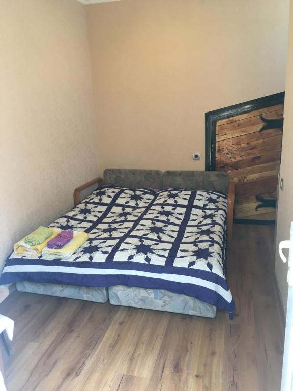 Postel nebo postele na pokoji v ubytování Apartment Zaziashvili 30
