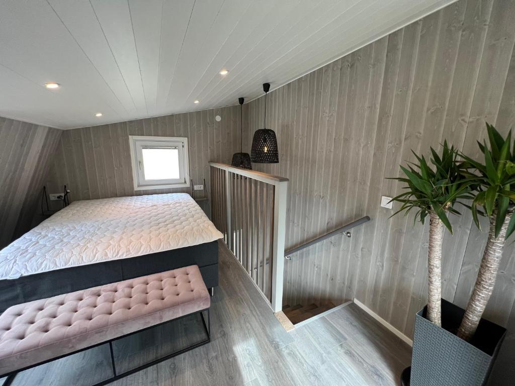 Postel nebo postele na pokoji v ubytování TinyHouze
