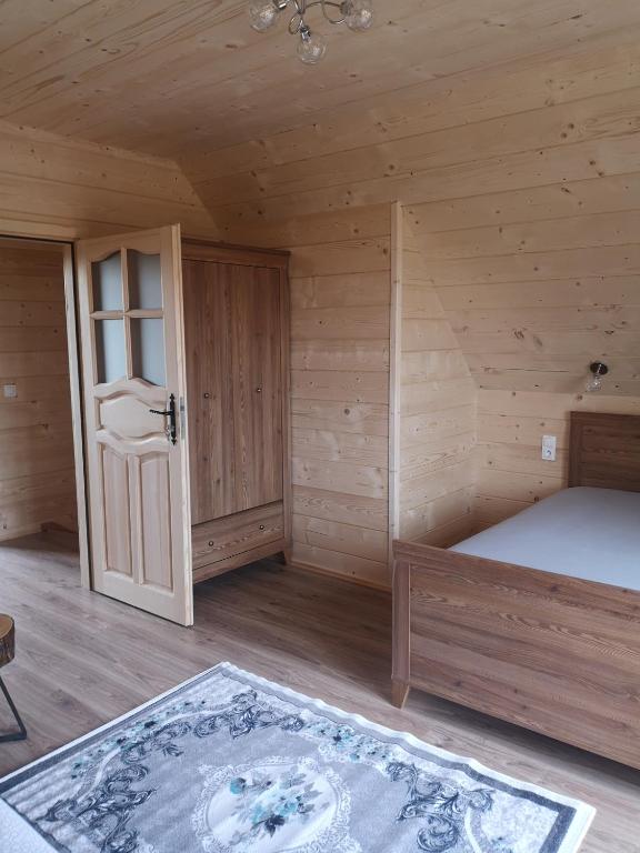 Posteľ alebo postele v izbe v ubytovaní DOMEK POD LIMBAMI V