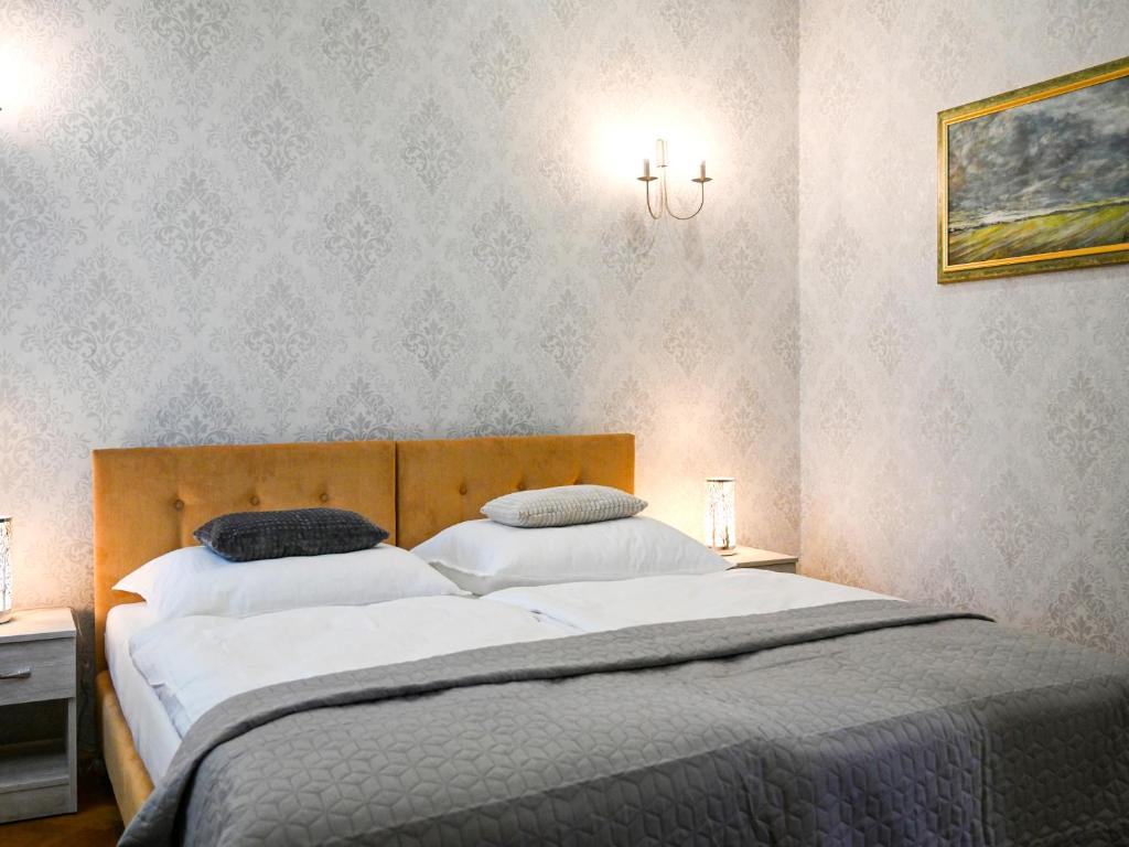 Postel nebo postele na pokoji v ubytování Zamek w Krokowej