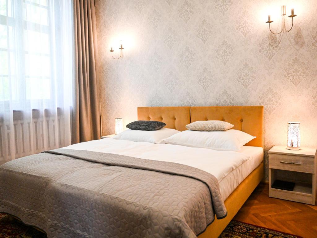 Postel nebo postele na pokoji v ubytování Zamek w Krokowej