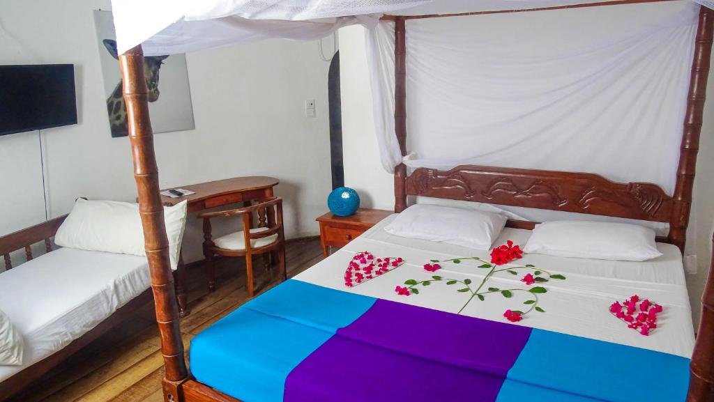 Postel nebo postele na pokoji v ubytování Lily Palm Resort