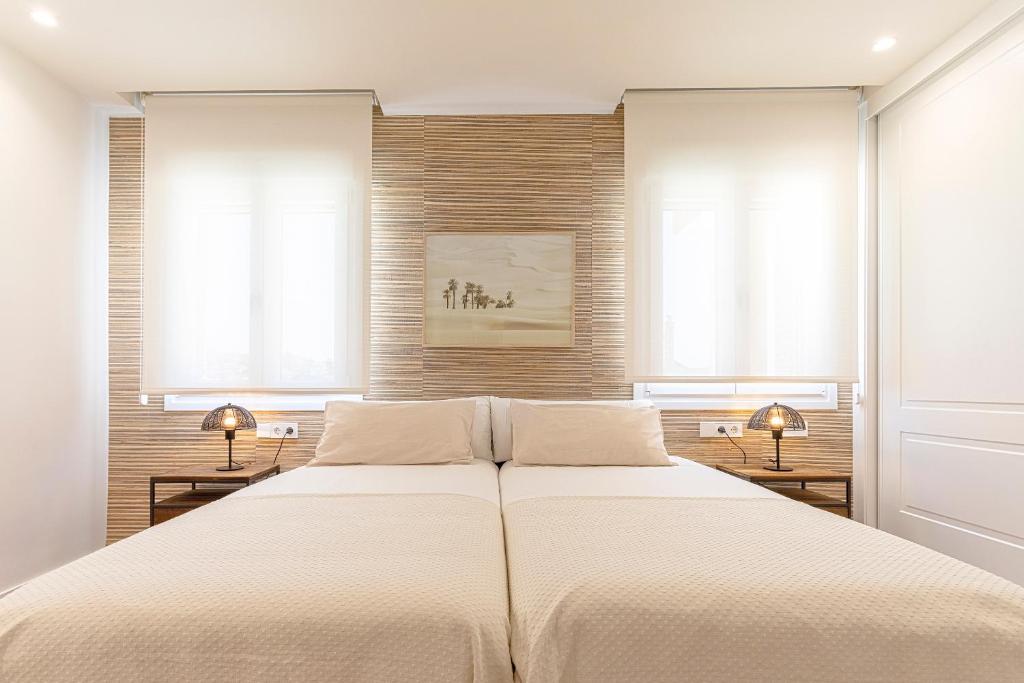 Кровать или кровати в номере Genteel Home Elcano Terrace