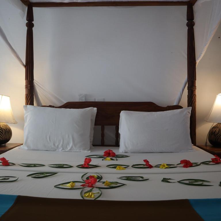 Postel nebo postele na pokoji v ubytování Lily Palm Resort