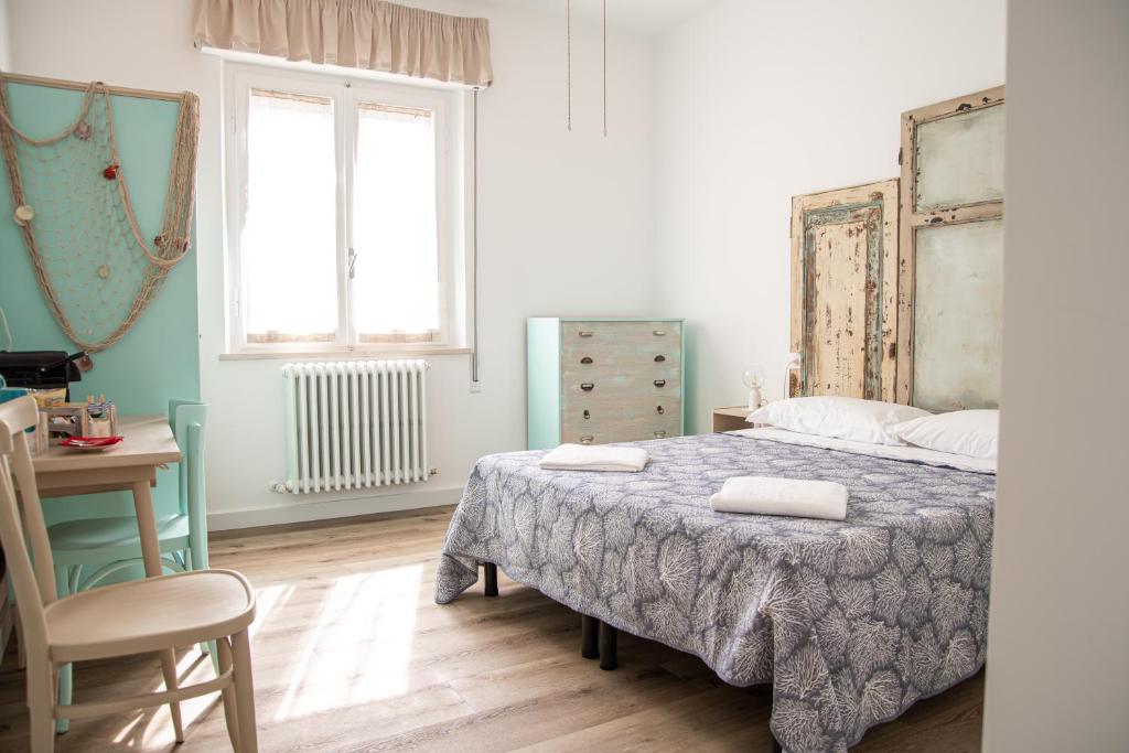 Postel nebo postele na pokoji v ubytování B&B DUE SORELLE