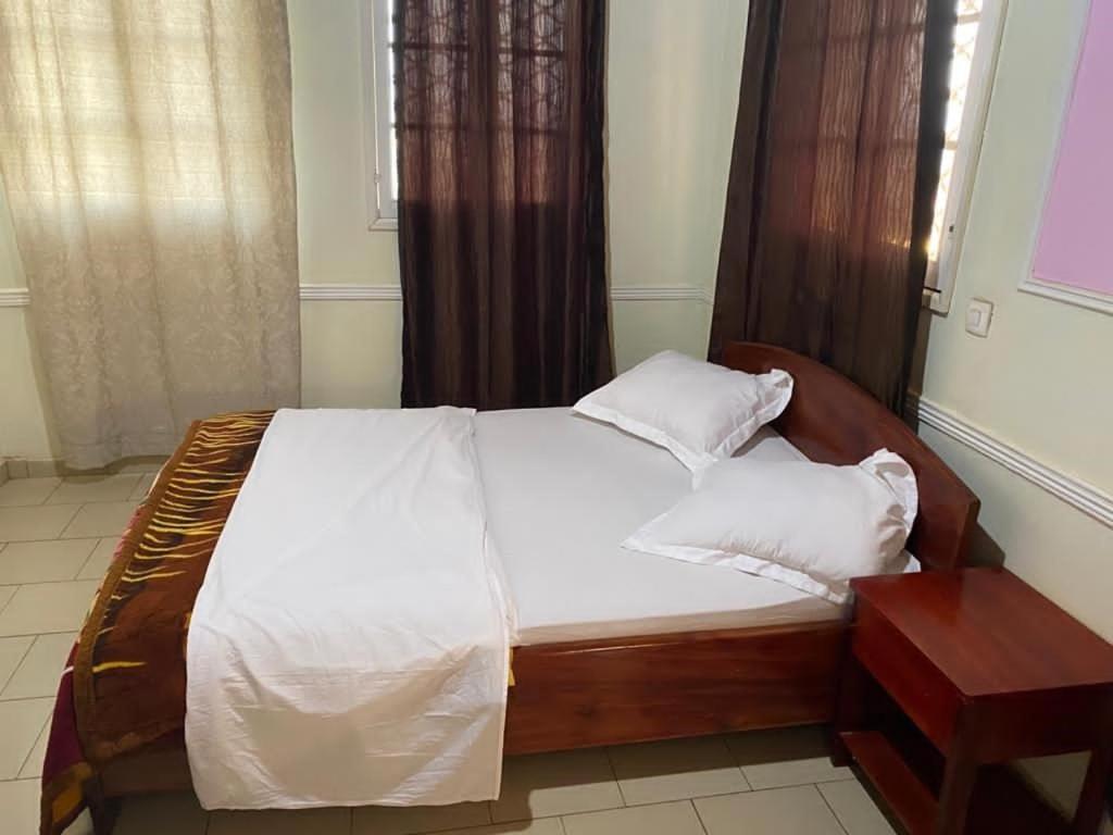 Letto o letti in una camera di MANOIR DES PRINCESSES BAFOUSSAM