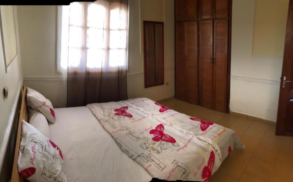 Letto o letti in una camera di MANOIR DES PRINCESSES BAFOUSSAM