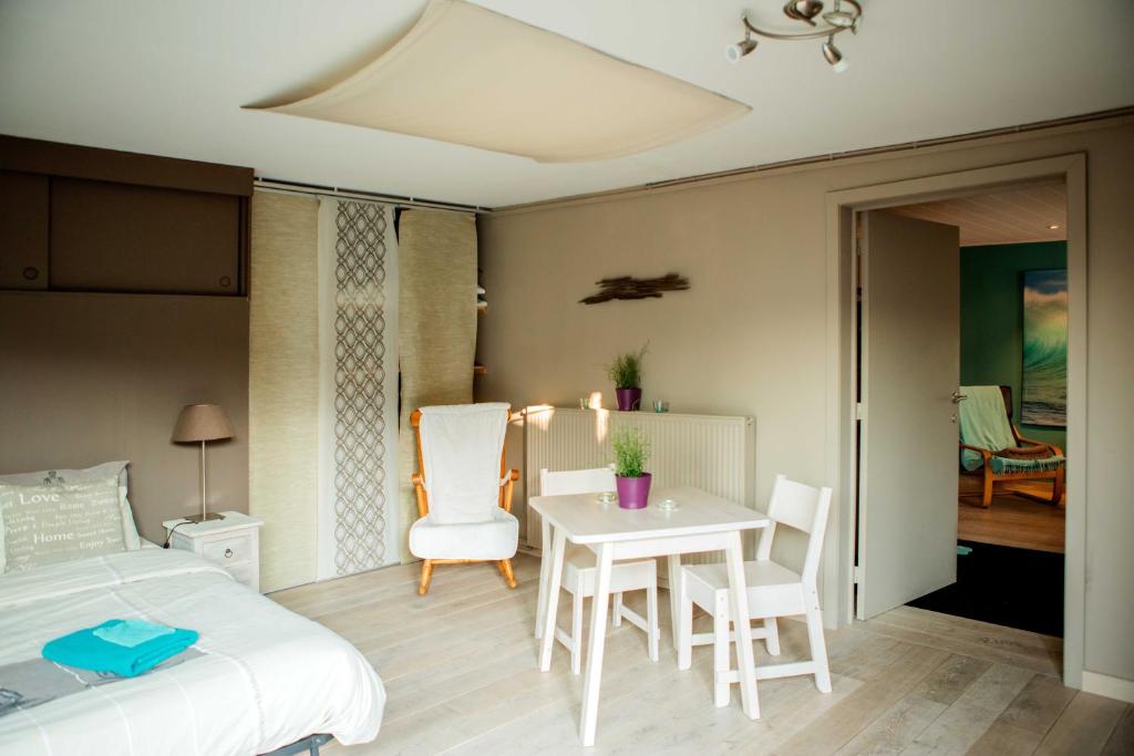 Postel nebo postele na pokoji v ubytování B&B 't Solveldje