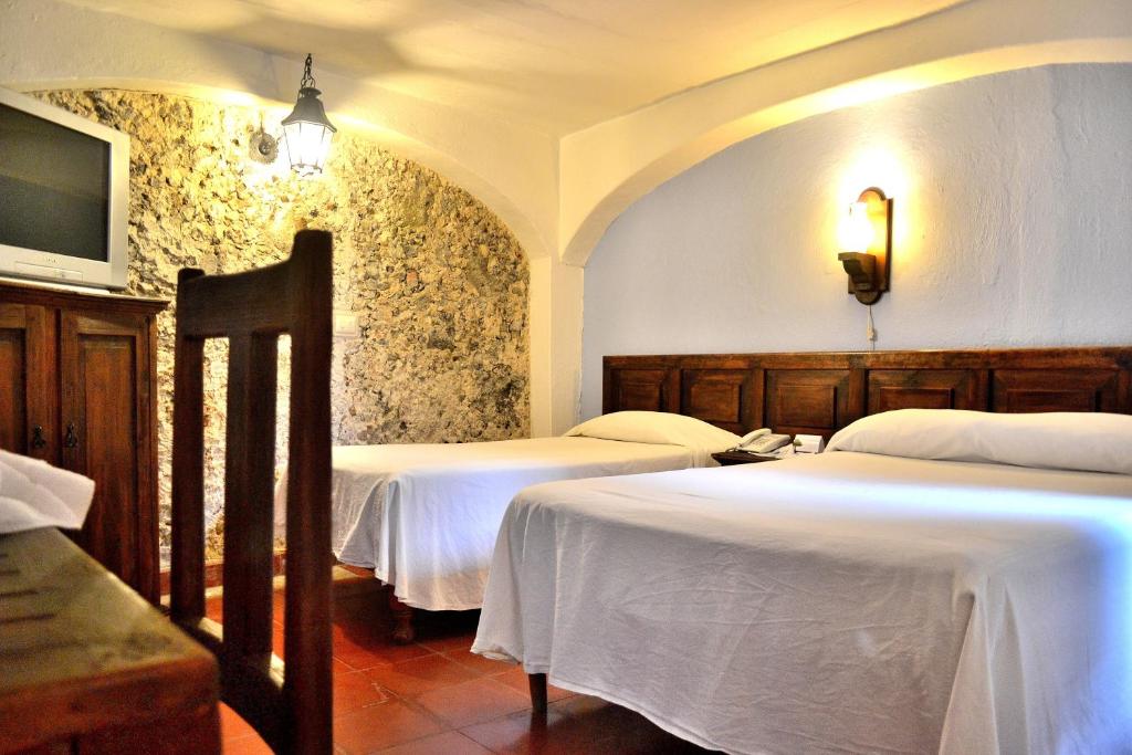 Postel nebo postele na pokoji v ubytování Posada del Cafeto