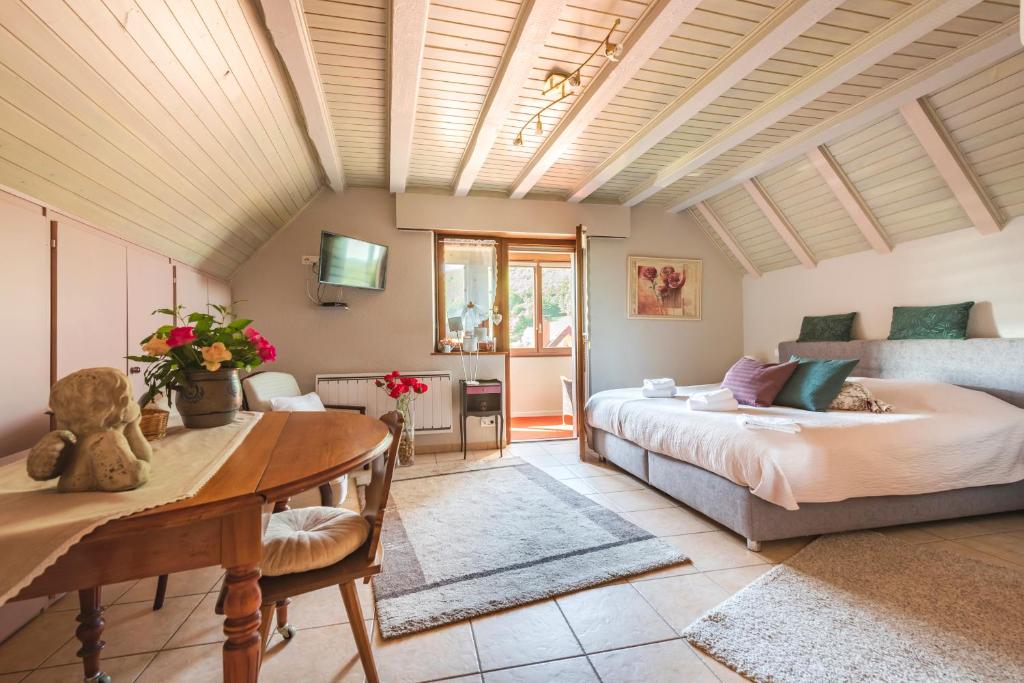 a bedroom with a bed and a table at Domaine Bleesz in Reichsfeld