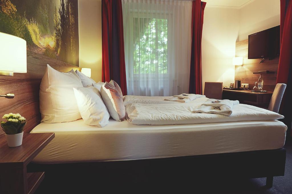 Postel nebo postele na pokoji v ubytování Hotel Mein Bergblick