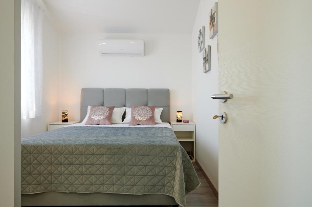 Postel nebo postele na pokoji v ubytování Villa Lilly