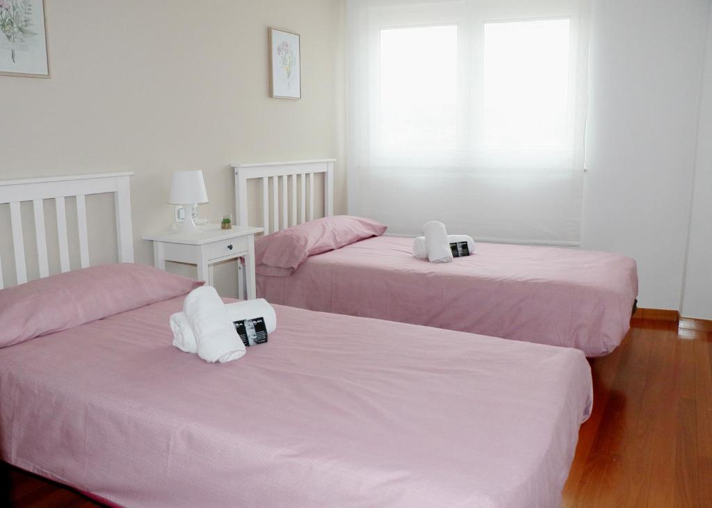 Postel nebo postele na pokoji v ubytování ÁTICO DUPLEX CREDENCIAL