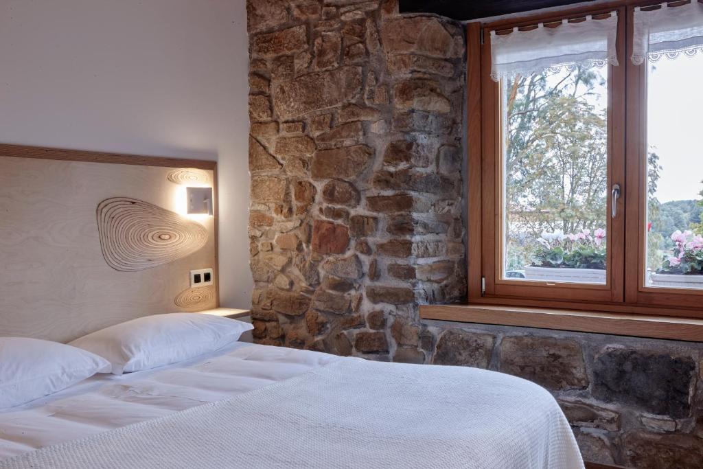 Postel nebo postele na pokoji v ubytování Apartamentos Ea Astei