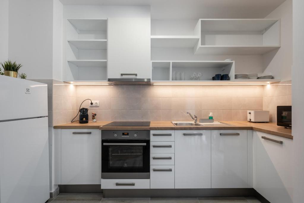 Kuchyňa alebo kuchynka v ubytovaní Szabolcs Apartments