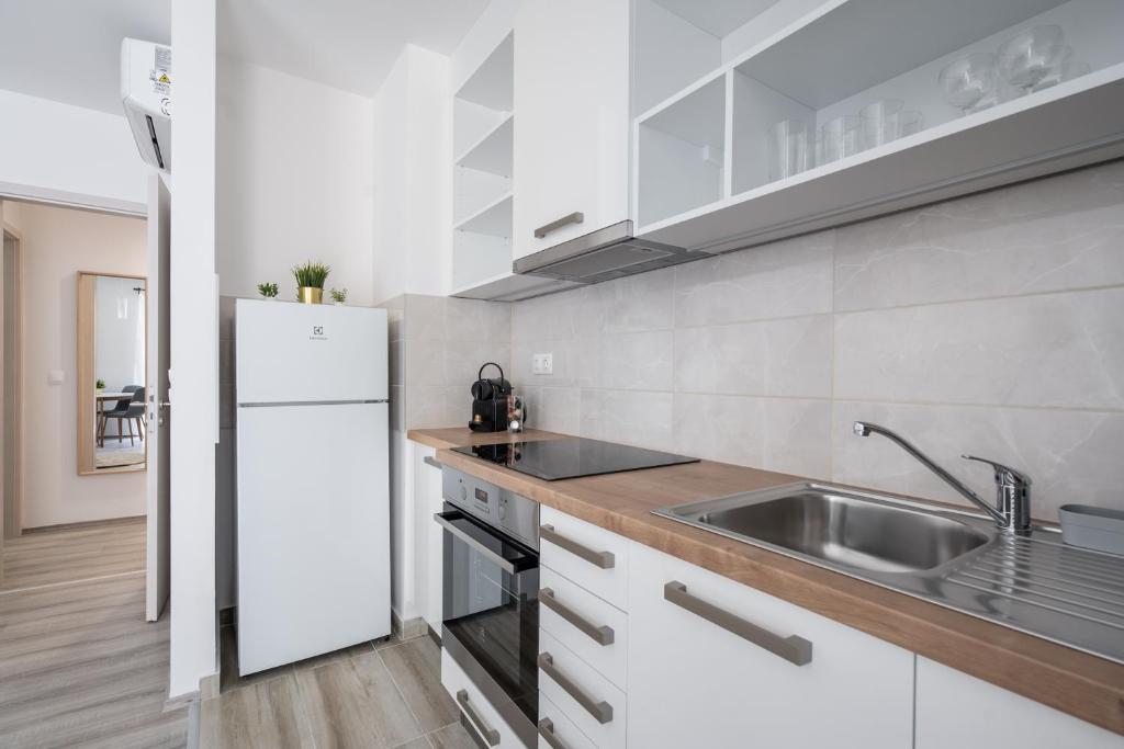 Kuchyňa alebo kuchynka v ubytovaní Szabolcs Apartments