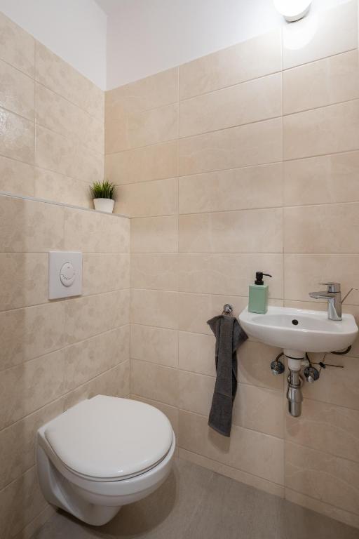 Kúpeľňa v ubytovaní Szabolcs Apartments