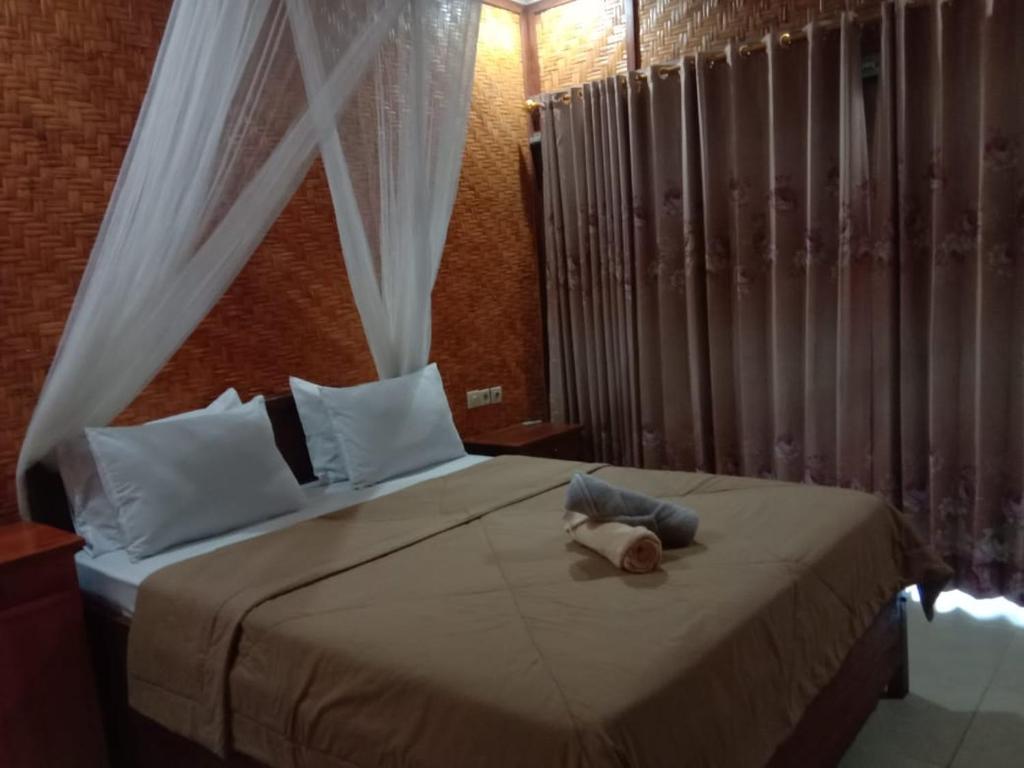Postel nebo postele na pokoji v ubytování Ila Homestay