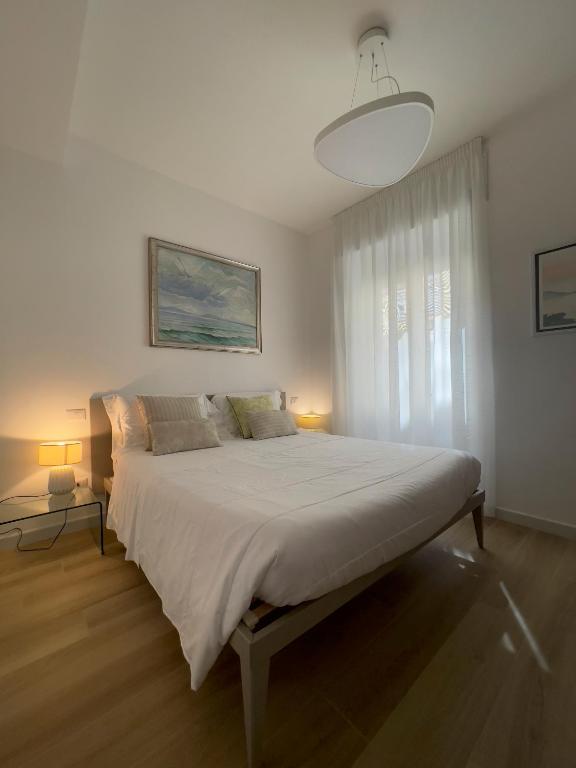Łóżko lub łóżka w pokoju w obiekcie B&B Il Gabbiano