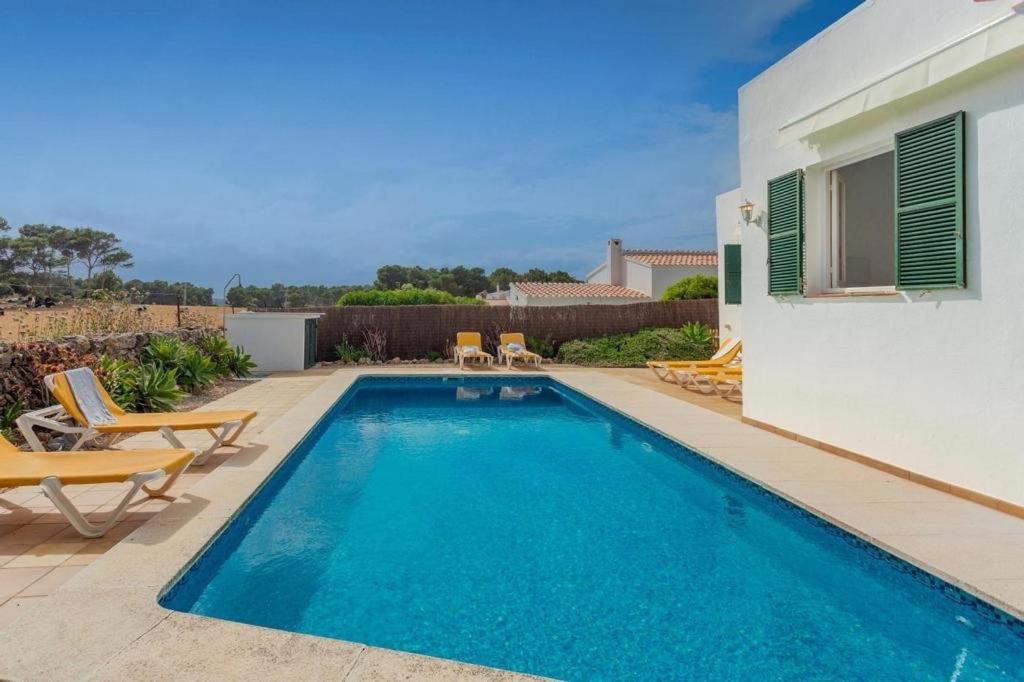 Casa con piscina compartida en Addaia