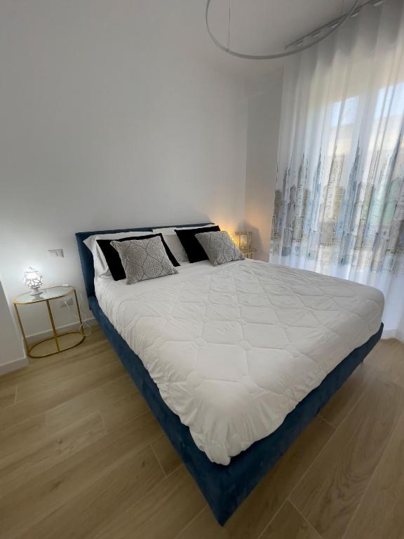 Łóżko lub łóżka w pokoju w obiekcie B&B Il Gabbiano