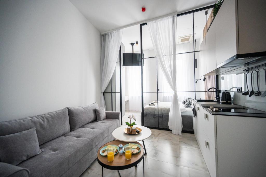 a living room with a couch and a table at Old Town Design Apartments in Sarajevo