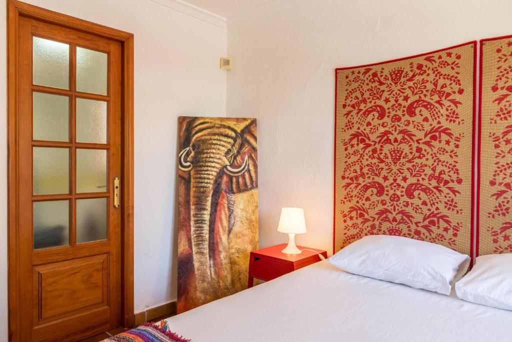 Postel nebo postele na pokoji v ubytování Villa Frida Kahlo