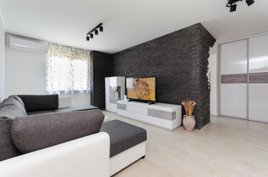 TV a/nebo společenská místnost v ubytování Apartment Slavko