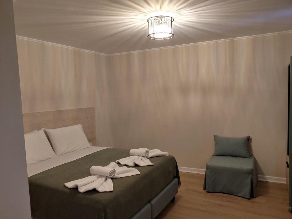 Postel nebo postele na pokoji v ubytování Saint george Hotel Parga